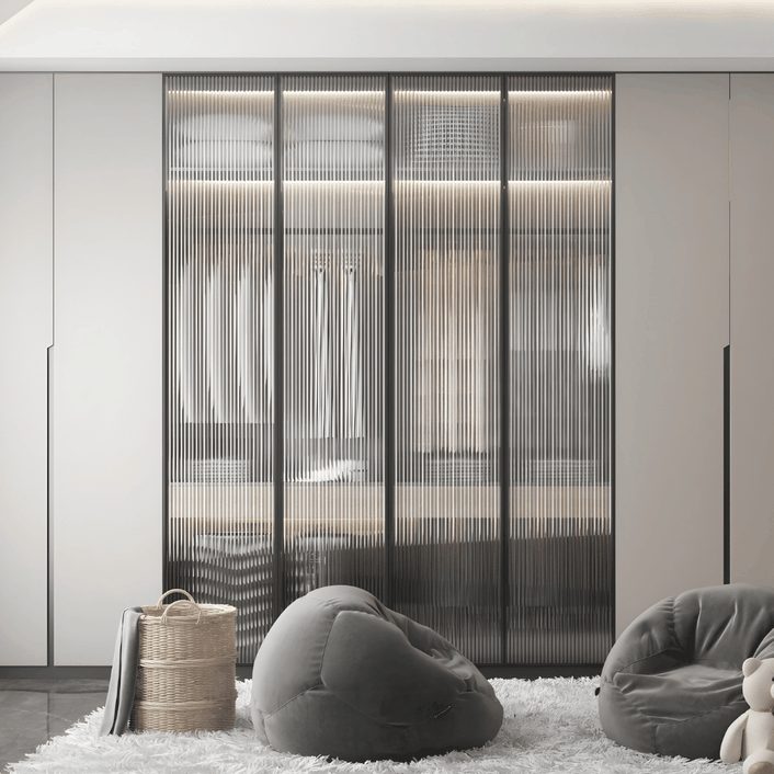 Elegant fluted glass wardrobe in minimalist bedroom interior with gray seating and woven basket decor. Elegant fluted glass wardrobe in minimalist bedroom interior with gray seating and woven basket decor.